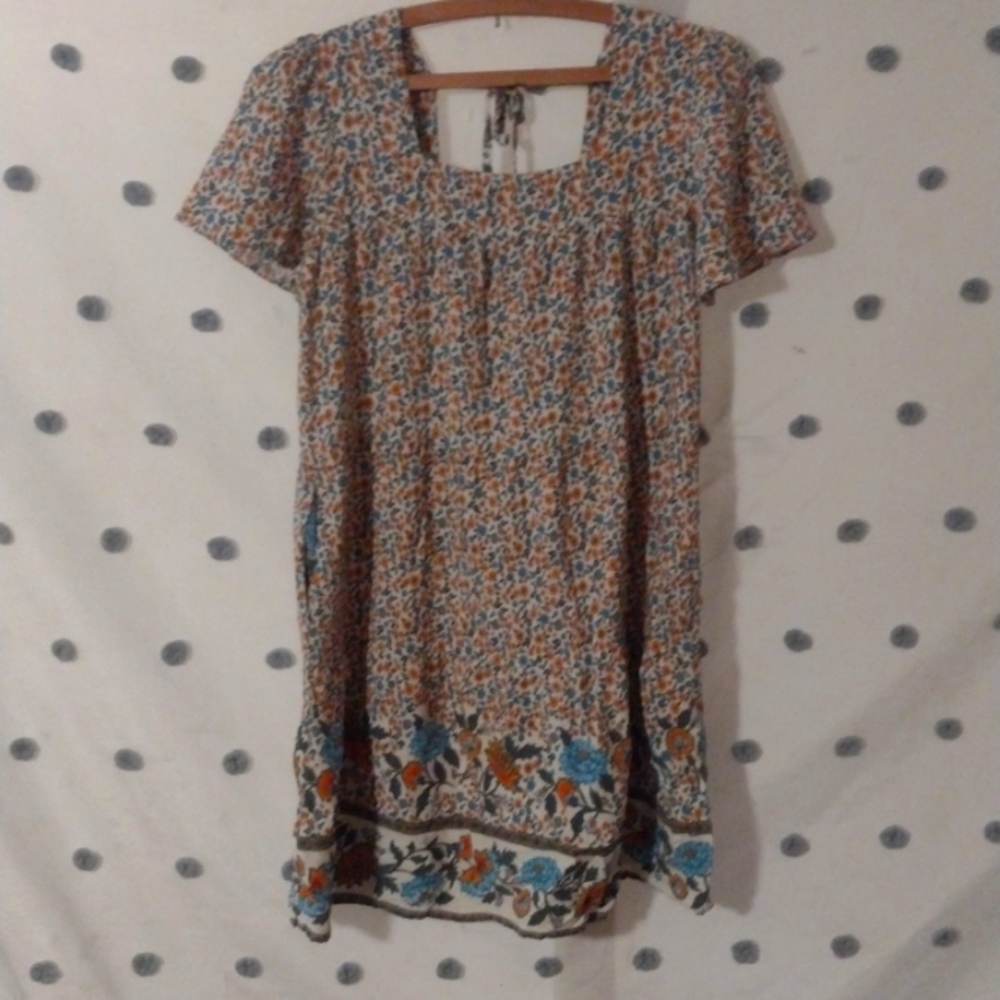 Adorable cottage core smock style floral mini dress with tie shoulder back